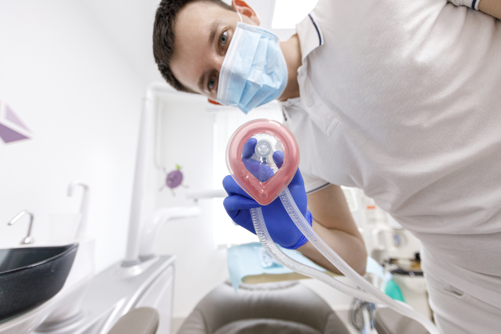 Dentist preparing to sedate a patient
